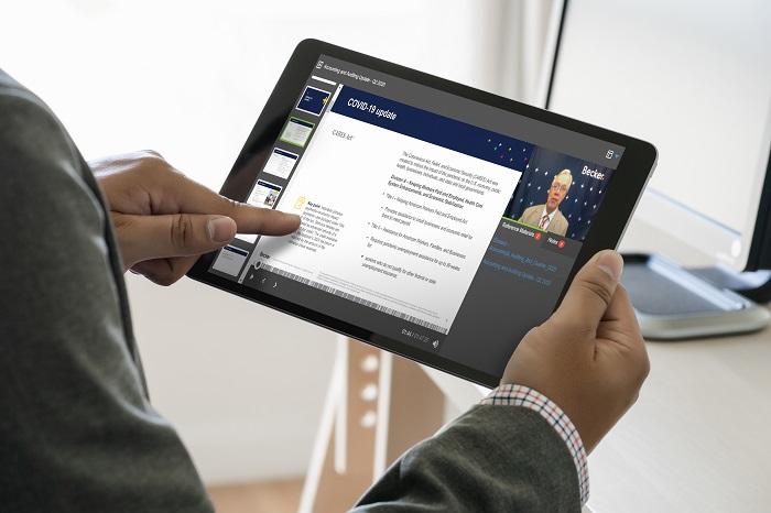 A person looks at the Becker site on a tablet