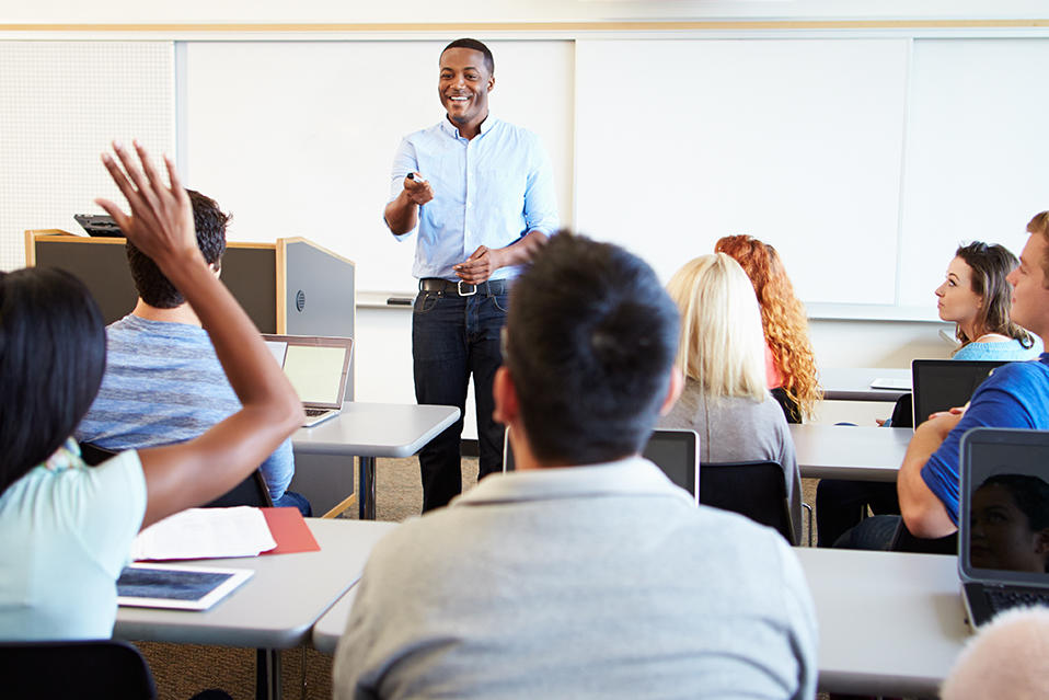 Teacher standing in front of classroom of students