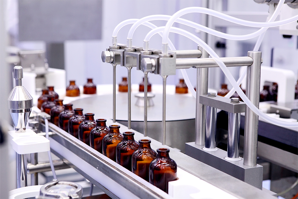 Pharmaceutical bottles being filled in a laboratory