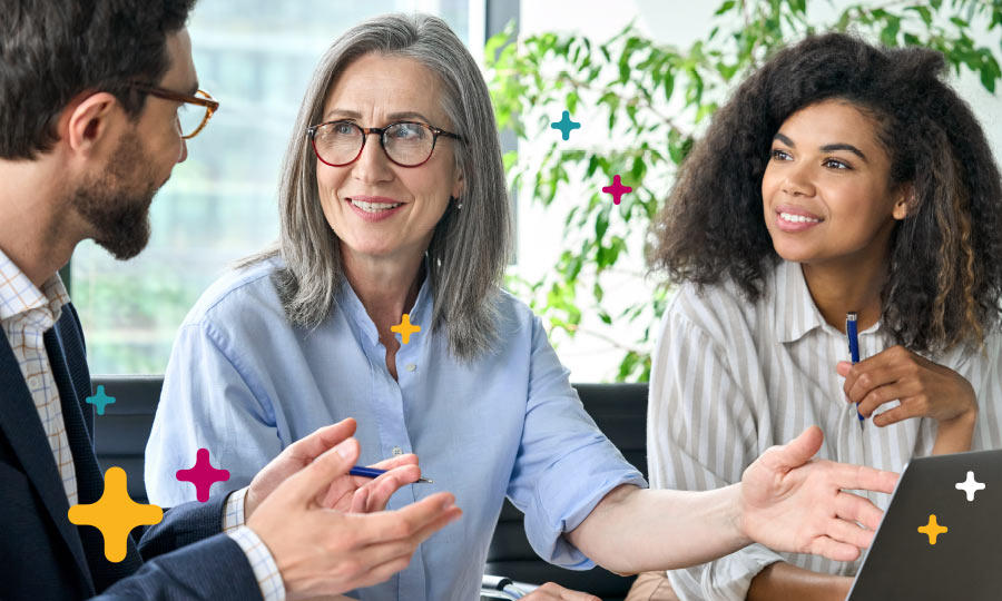 Group of business people reviewing document on computer