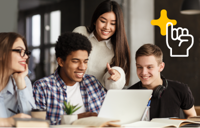 Group of college-aged students looking at a laptop