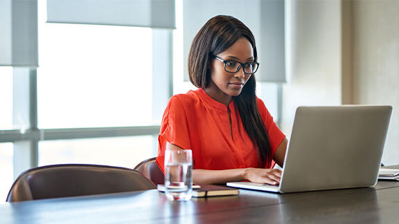 Woman typing on a laptop