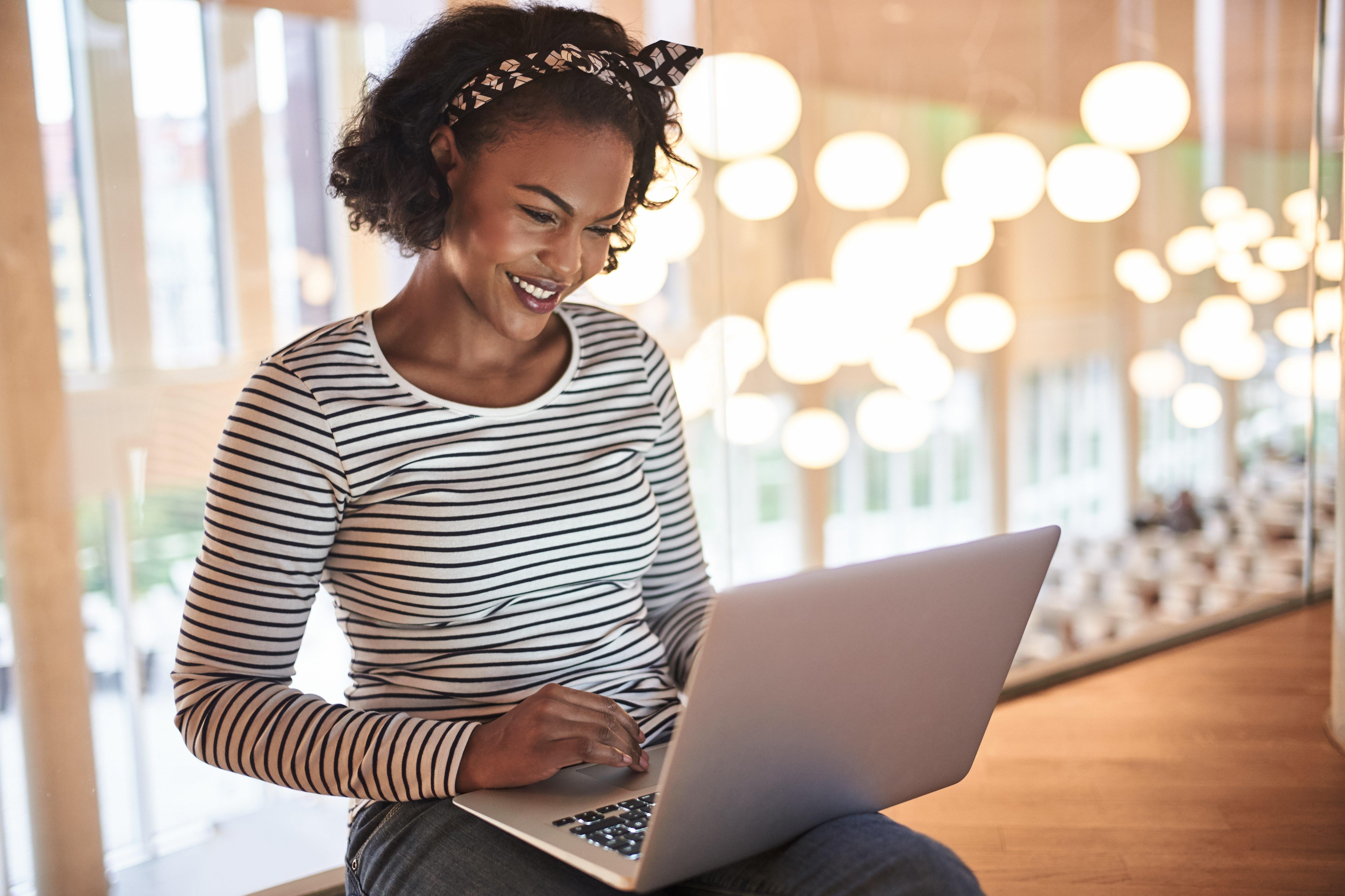Woman looking at laptop