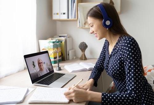 Woman looking at laptop