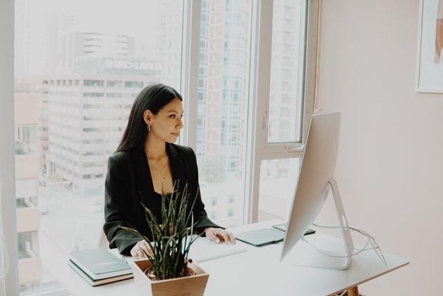 woman working on a desktop computer