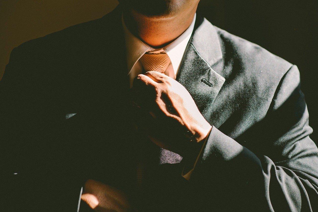 A man tying a tie