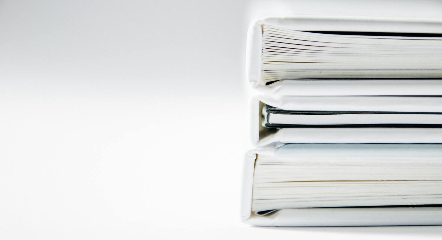 Stack of books on white background