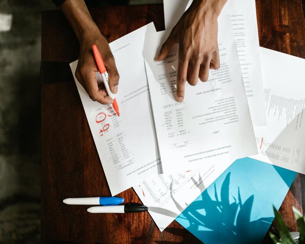 close up of hands doing accounting work