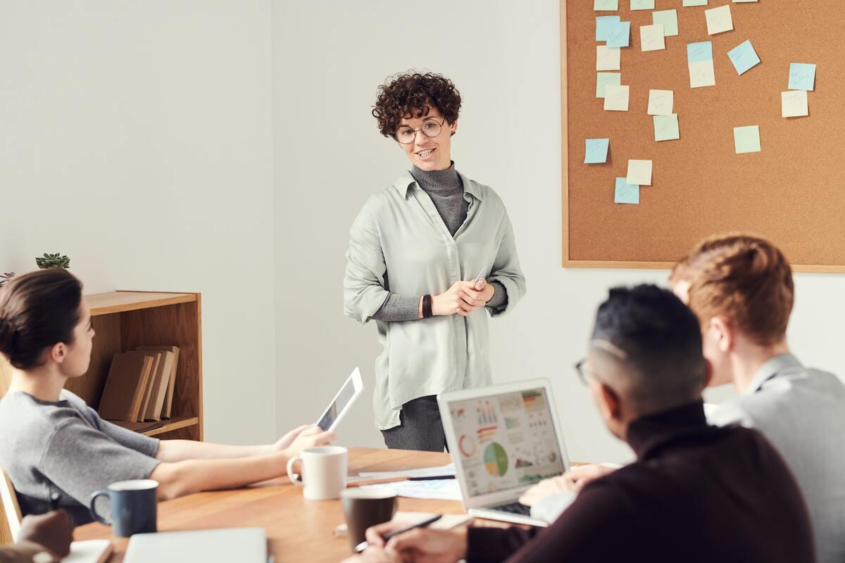 Young professional presenting to coworkers in an office