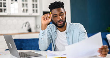 A young black student studying for a test