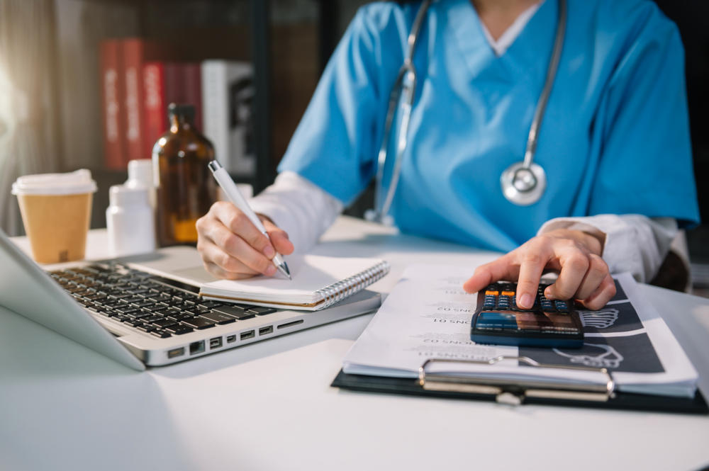 healthcare worker doing bookkeeping