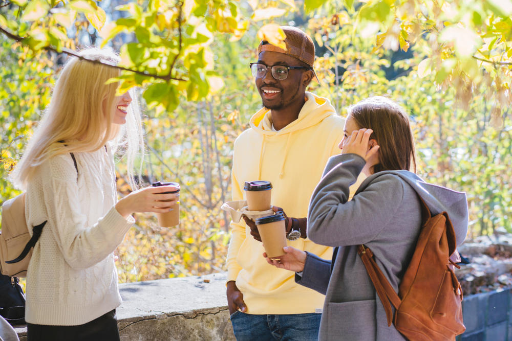 three people taking a study break with coffee