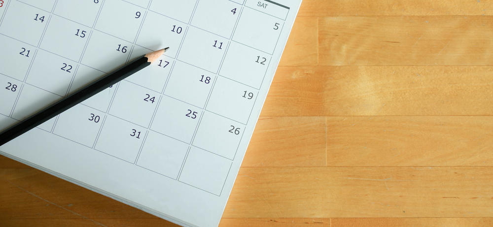 calendar and pencil on a desk