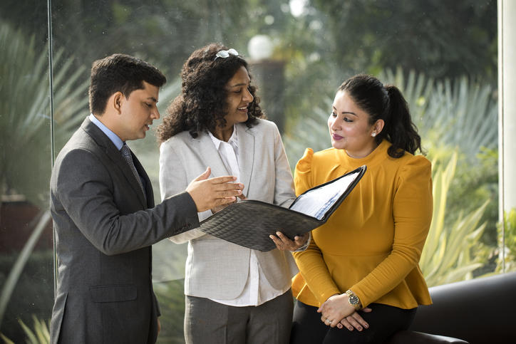 three colleagues meeting