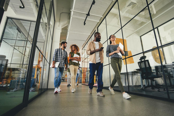 young people walking down a hallway