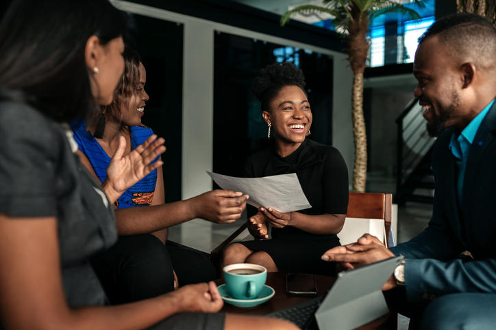 professionals talking around a coffee table