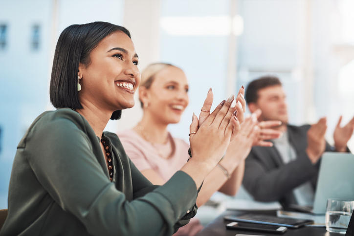 people clapping in an office