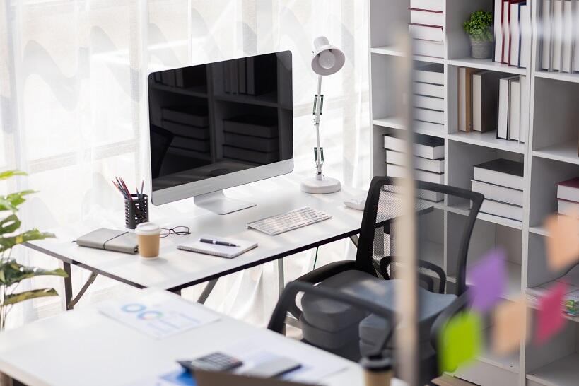 Opening a CPA firm - a shot of a new office with a computer, shelves, and window