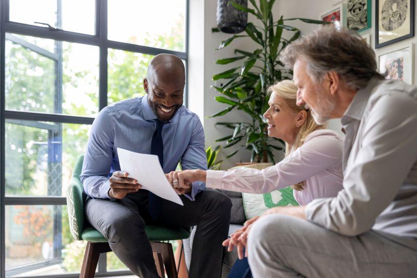 Young man working as both accountant and financial planner to assist clients