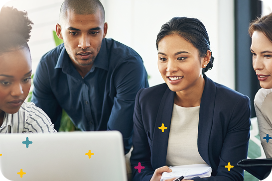 team around a laptop