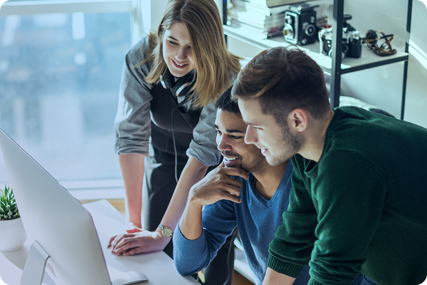 3 people around a computer