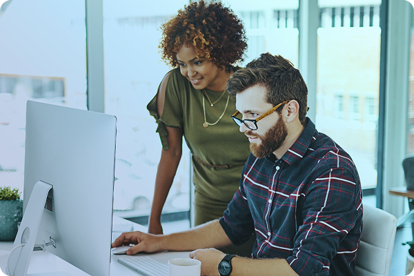 two people looking at a monitor
