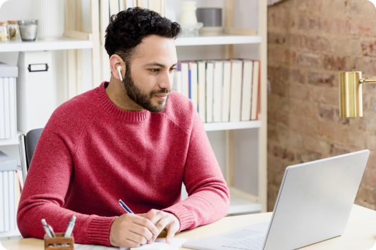 man looking at a laptop