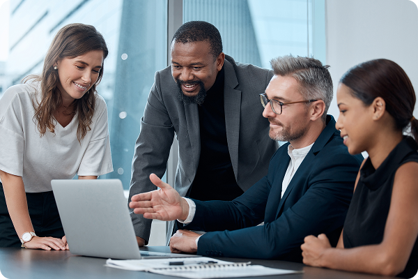 group of people looking at a laptop