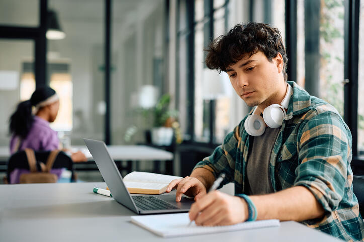 Young man using Becker's structured CPA Exam review to study for the CPA Exam
