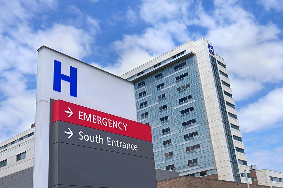 Outside view of a hospital. The text "SOUTH ENTRANCE and EMERGENCY" are visible